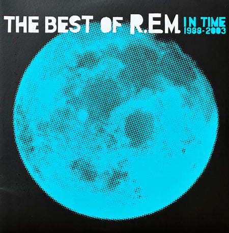 R.E.M. In Time vinyl record cover featuring blue halftone moon and bold white text.