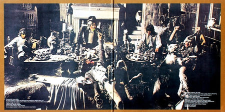Vintage vinyl album gatefold art featuring people in an extravagant banquet scene, dark tones