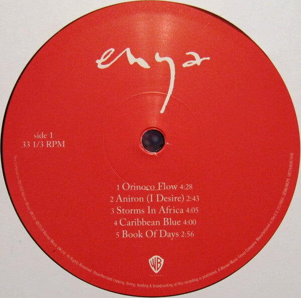 Red Enya vinyl record label featuring song titles Orinoco Flow, Aníron, Storms In Africa, Caribbean Blue, and Book Of Days.