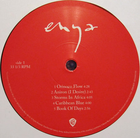 Red Enya vinyl record label featuring song titles Orinoco Flow, Aníron, Storms In Africa, Caribbean Blue, and Book Of Days.