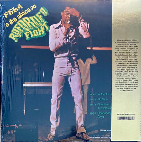 Vinyl record cover of Fela & The Africa 70 Roforofo Fight, musician singing on stage.