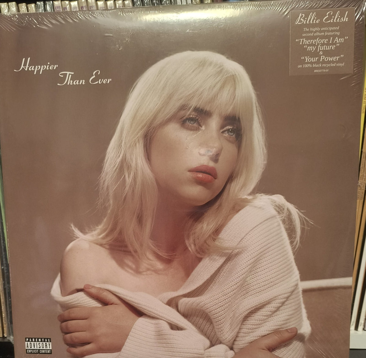 Billie Eilish Happier Than Ever vinyl record album cover with moody portrait and beige sweater.
