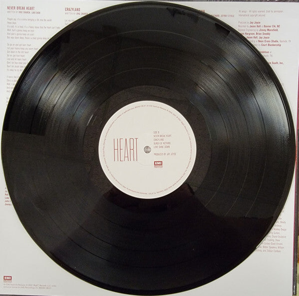 Heart vinyl record on white background with visible tracklist and EMI label