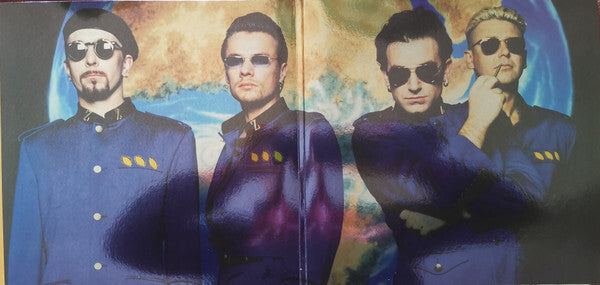 Four men in matching blue uniforms and sunglasses posing in front of a world map, vinyl album art