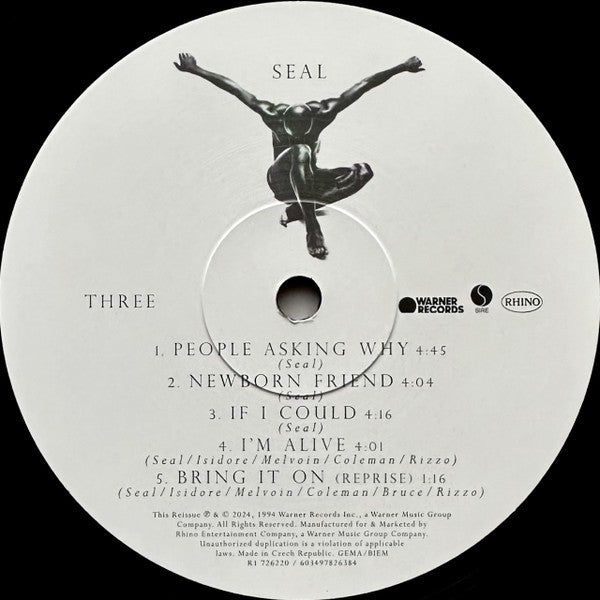 Seal vinyl record label with tracklist, black stylized figure, Warner and Rhino logos