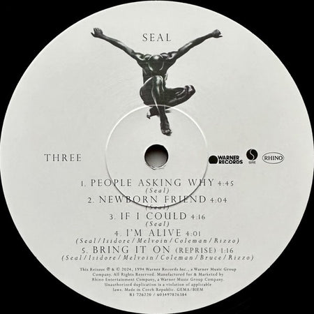 Seal vinyl record label with tracklist, black stylized figure, Warner and Rhino logos