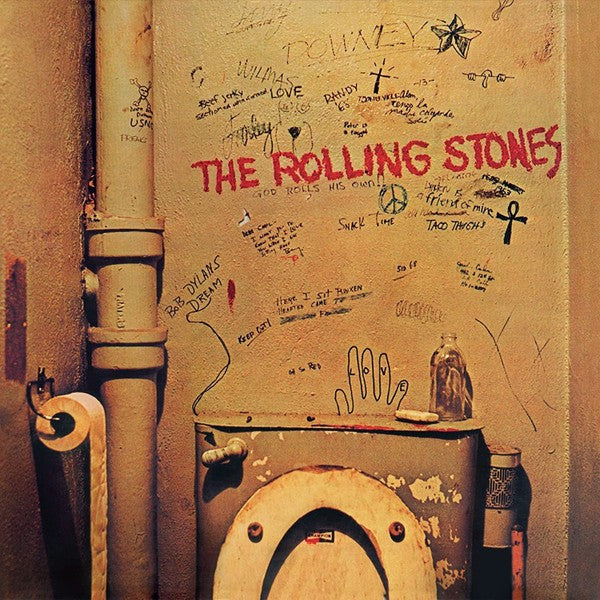 Rolling Stones vinyl record cover with graffiti-covered bathroom wall and toilet