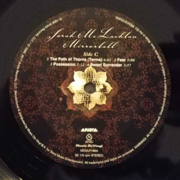Sarah McLachlan Mirrorball vinyl record label with tracklist and floral design motif.