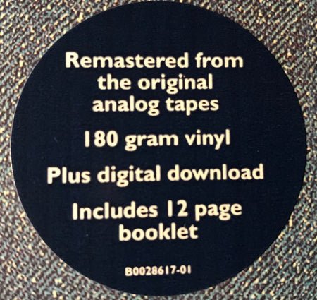 Sticker on vinyl record highlighting remastered analog tapes, 180 gram vinyl, digital download, booklet.