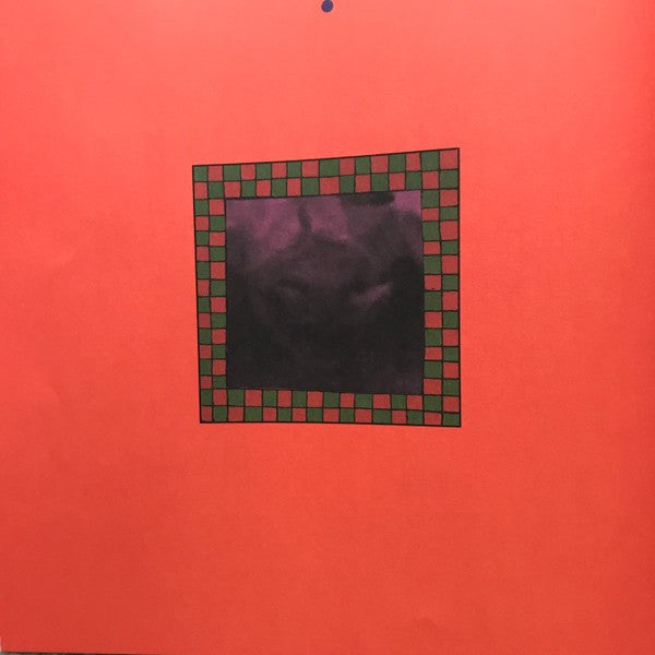 Vinyl record cover with a red background and black center square framed by green and red checkerboard border
