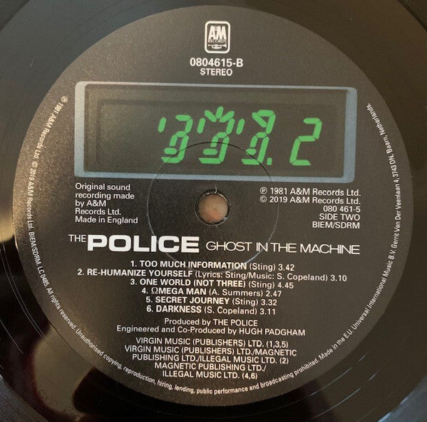 The Police Ghost in the Machine vinyl record label with digital numbers and track listing visible.