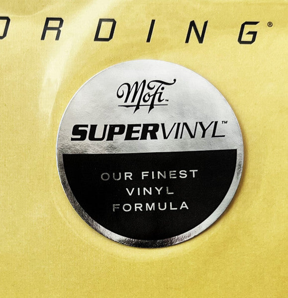 MoFi SuperVinyl sticker on yellow background, promoting premium vinyl record formula