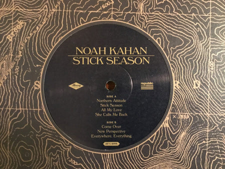 Noah Kahan Stick Season vinyl record label with album tracklist on abstract topographic background