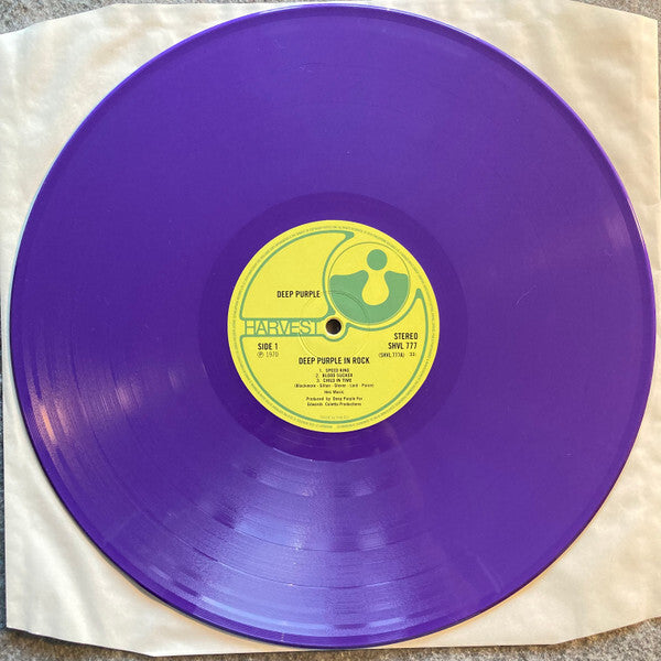 Purple vinyl record of Deep Purple In Rock with yellow Harvest label on white sleeve