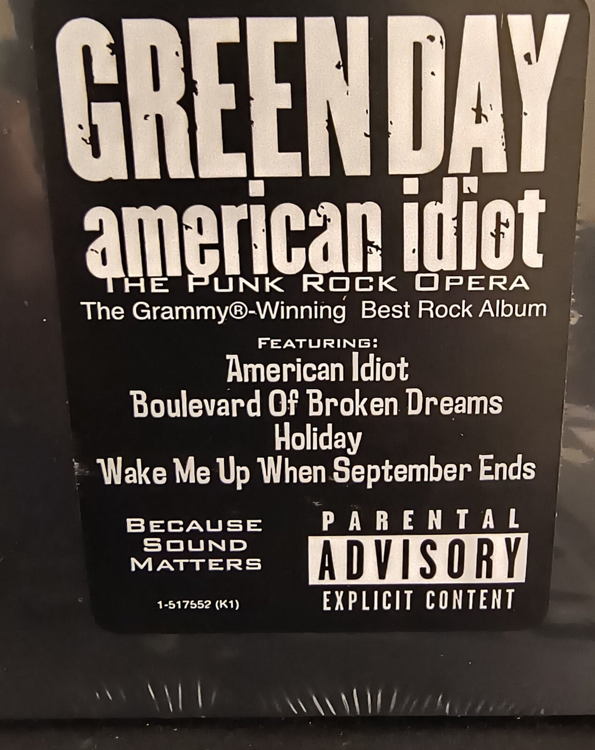 Green Day American Idiot vinyl record cover featuring album title, tracklist, and Parental Advisory label