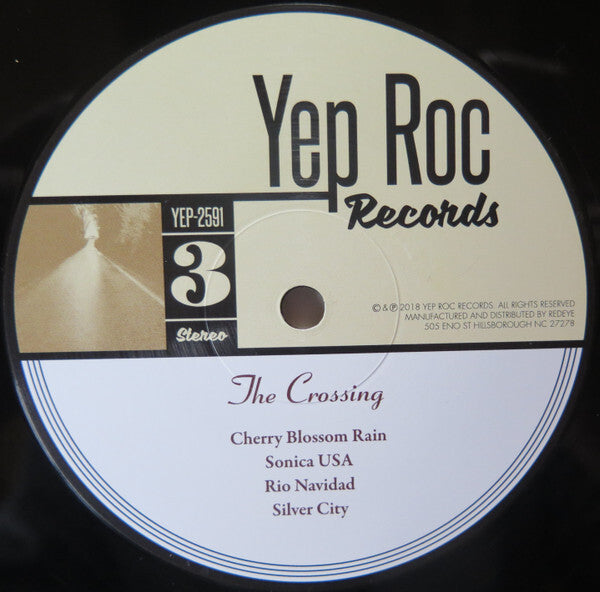 Yep Roc Records vinyl label for The Crossing album, tracklist visible on record.
