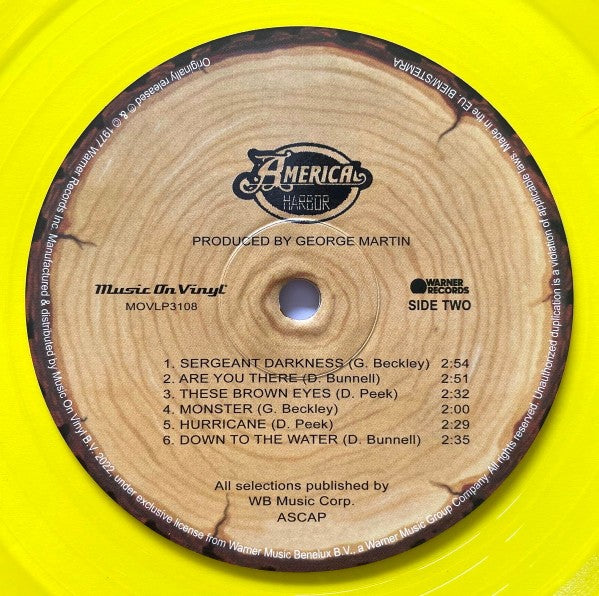 Yellow vinyl record with 'America Harbour' album label and song list, Music On Vinyl release.