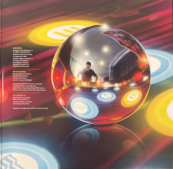 Colorful vinyl record album cover featuring a reflective orb with music symbols and tracklist.