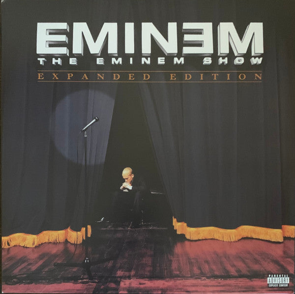The Eminem Show Expanded Edition vinyl cover featuring stage curtains, a microphone, and a seated man.