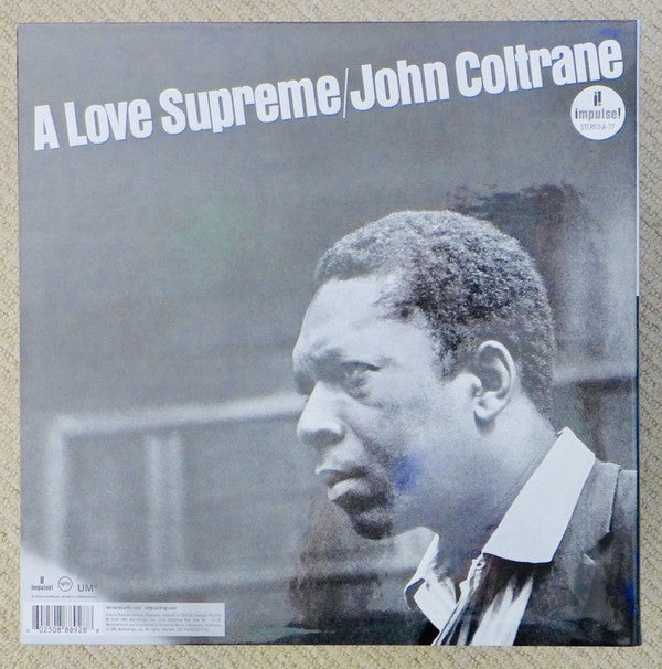 A Love Supreme by John Coltrane vinyl record album cover featuring a black and white portrait.