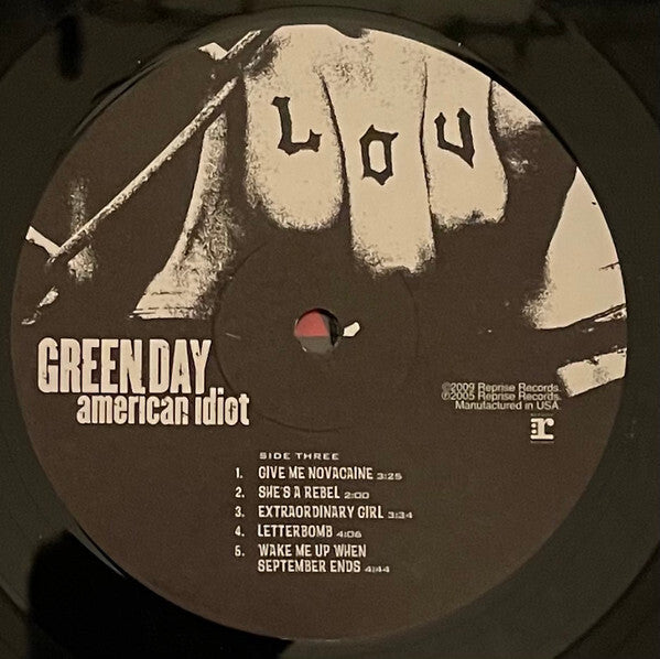Green Day American Idiot vinyl record label with song list and tattooed hand artwork