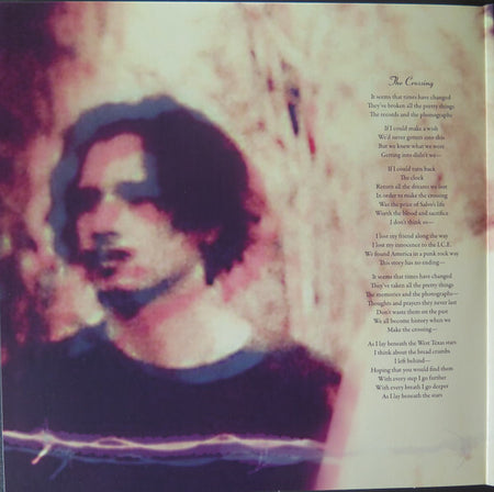 Blurred portrait of a man next to printed song lyrics, moody vinyl record artwork