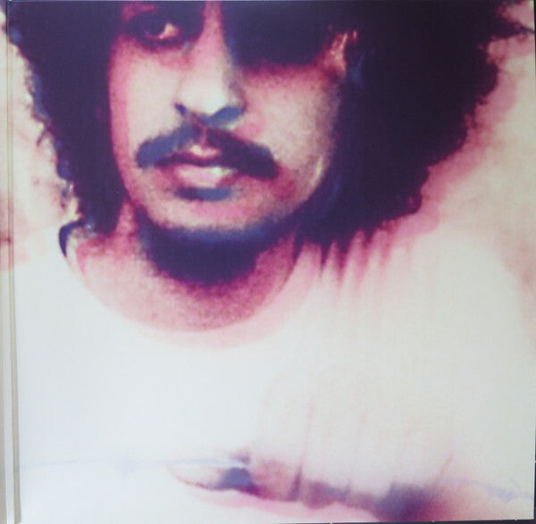 Vintage style vinyl record cover featuring a blurred portrait of a man with curly hair and mustache
