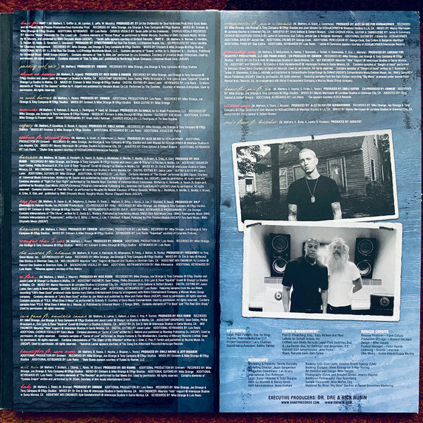 Vinyl record gatefold with song credits, lyrics, and two black-and-white artist photos.
