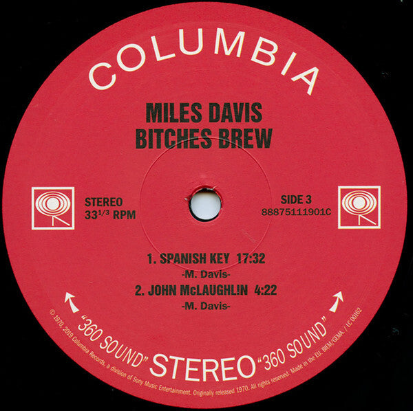 Miles Davis Bitches Brew vinyl record label, red Columbia label featuring track titles and durations.