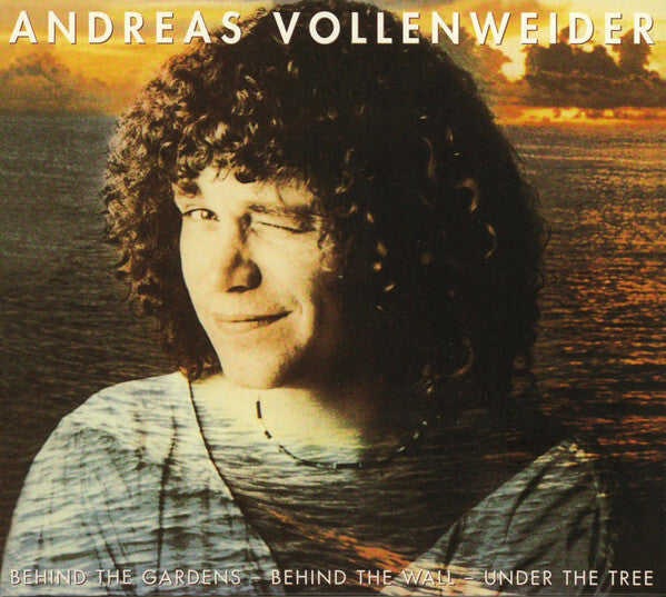 Andreas Vollenweider album cover with winking person overlaid on a sunset lake scene