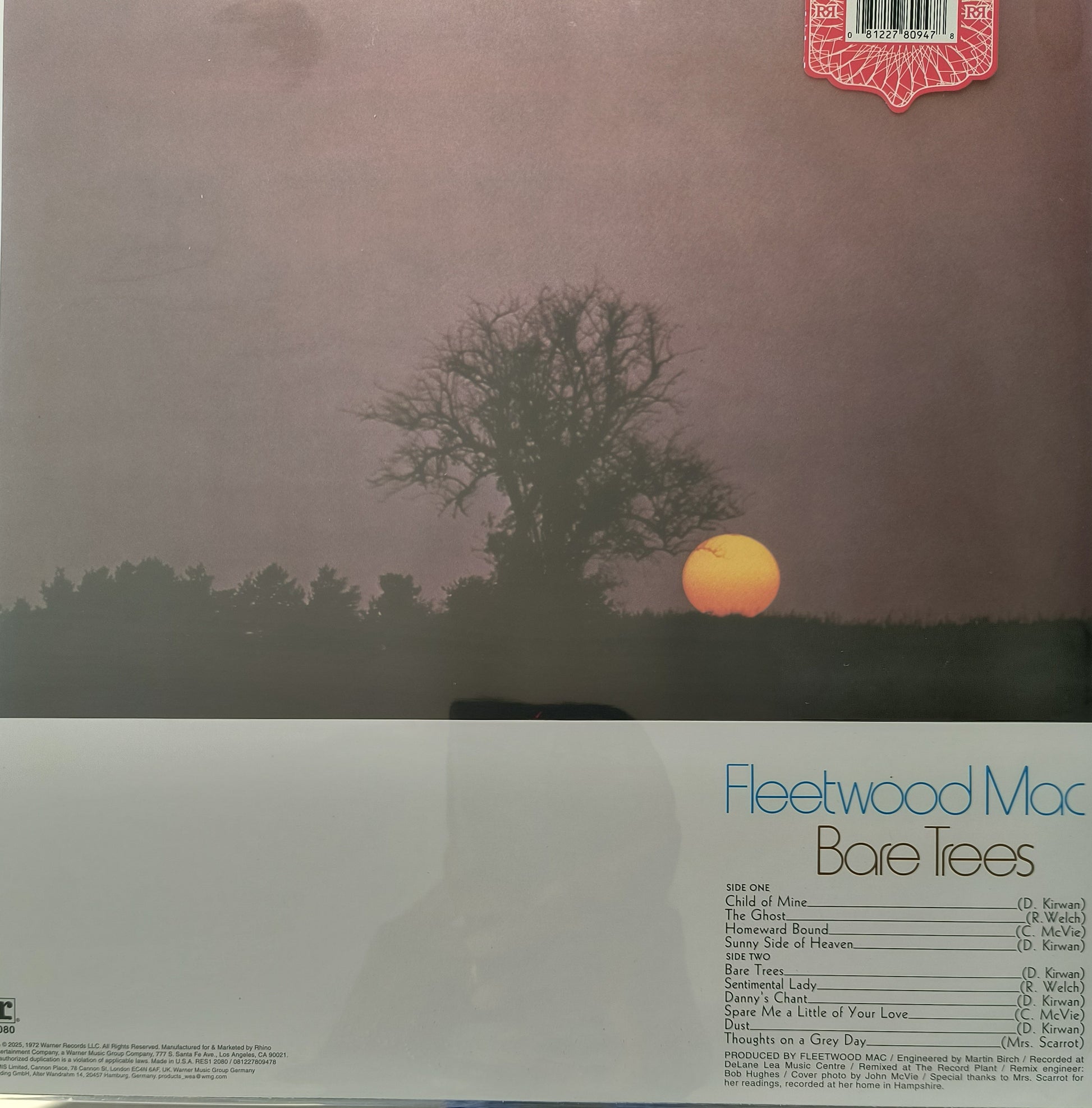 Vinyl record cover for Fleetwood Mac's 'Bare Trees' with a sunset and tree silhouette. 
