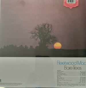 Vinyl record cover for Fleetwood Mac's 'Bare Trees' with a sunset and tree silhouette. 
