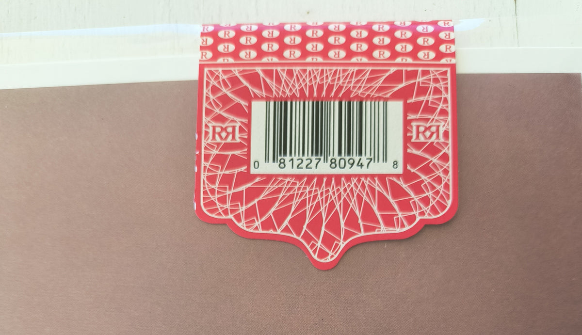 Fleetwood Mac Bare Trees Red hype sticker with a barcode on a brown surface