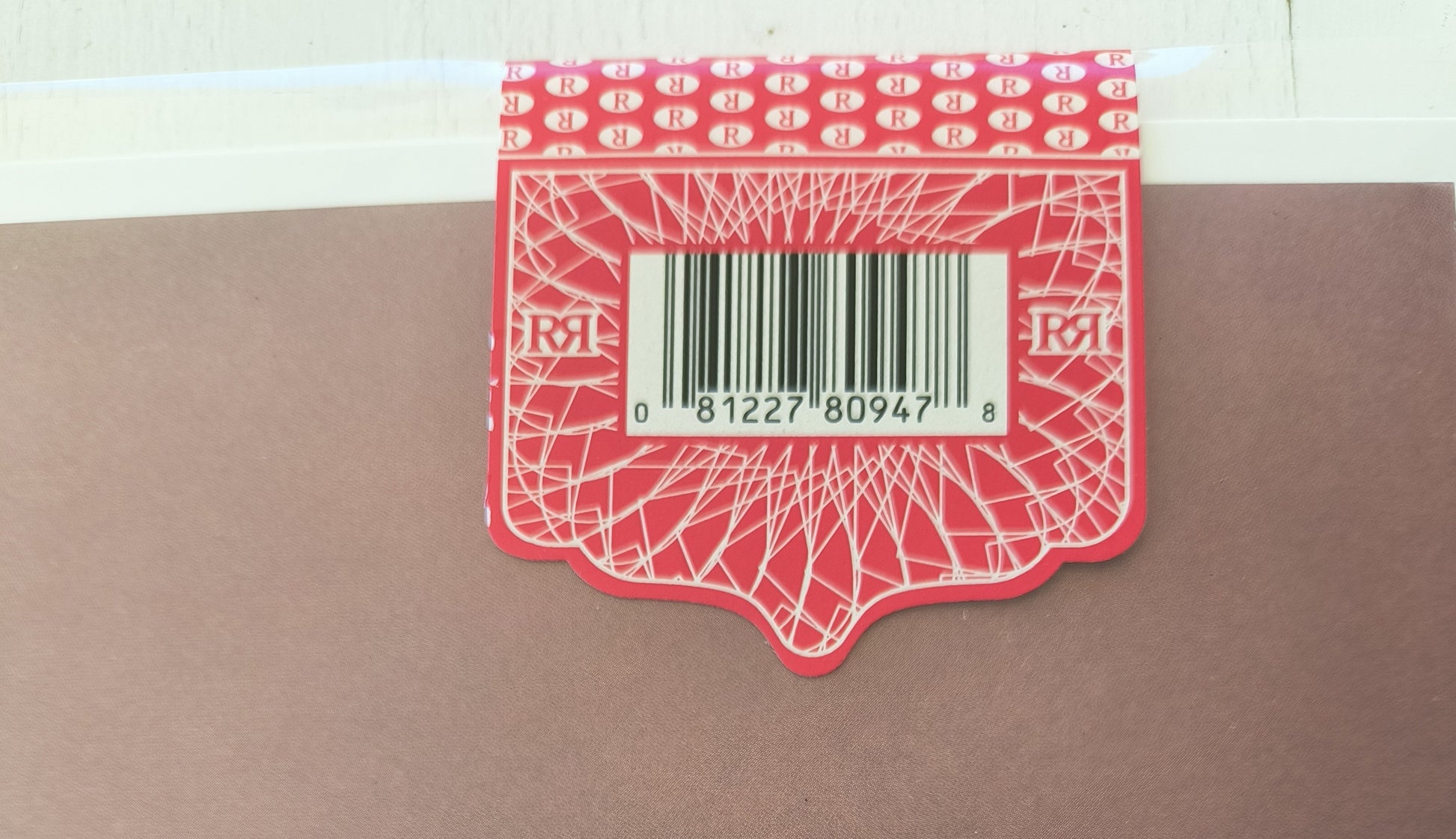 Fleetwood Mac Bare Trees Red hype sticker with a barcode on a brown surface