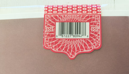 Fleetwood Mac Bare Trees Red hype sticker with a barcode on a brown surface