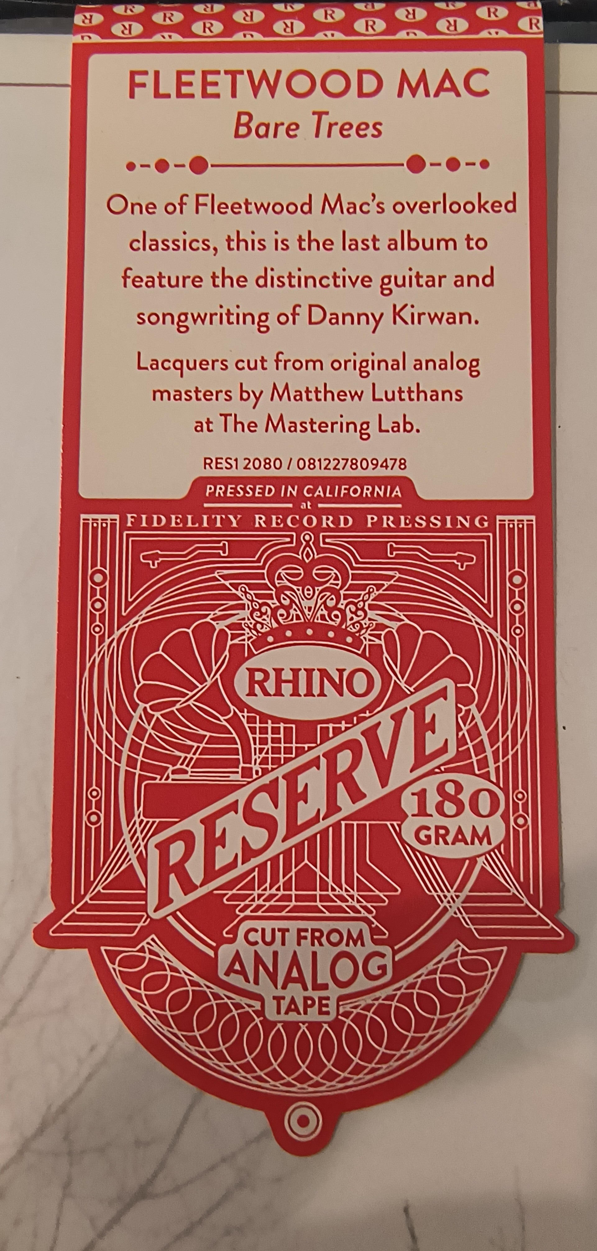 Red hype sticker with text One of Fleetwood Mac's overlooked classics) and branding for Fleetwood Mac's 'Bare Trees' on a light gray background. 