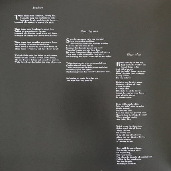 Black vinyl record inner sleeve with white printed song lyrics in three columns.
